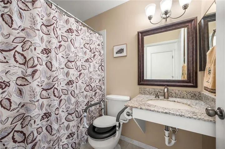 Vanity with a polished chrome faucet and an oval basin