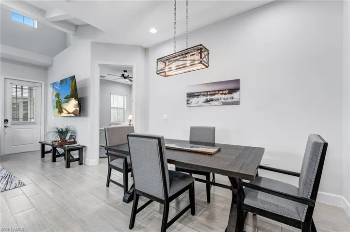 Dining room with light wood finished floors, recessed lighting, and ceiling fan