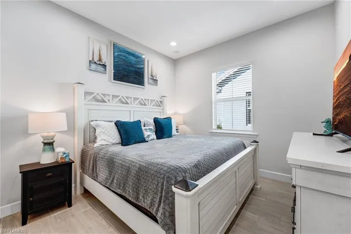 Bedroom featuring light wood finished floors and recessed lighting