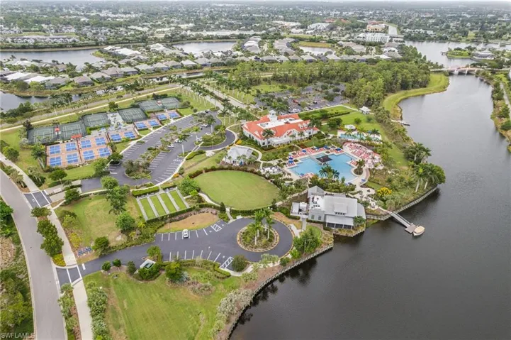 Aerial view of property and surrounding area with a large body of water