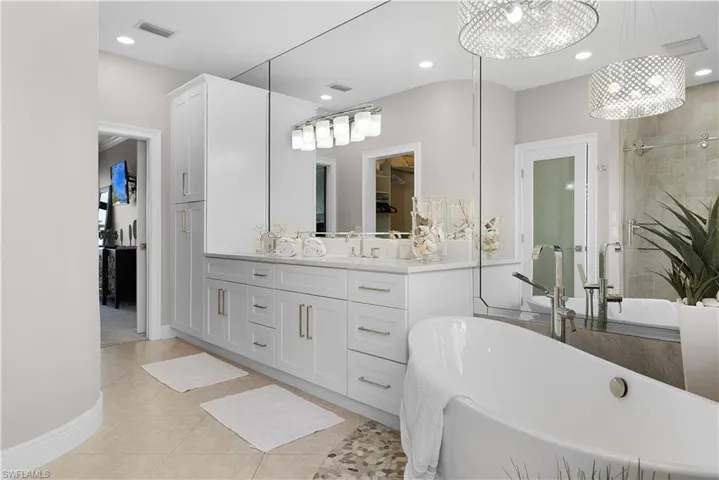 Living area featuring recessed lighting, baseboards, ceiling fan, and light tile patterned floors