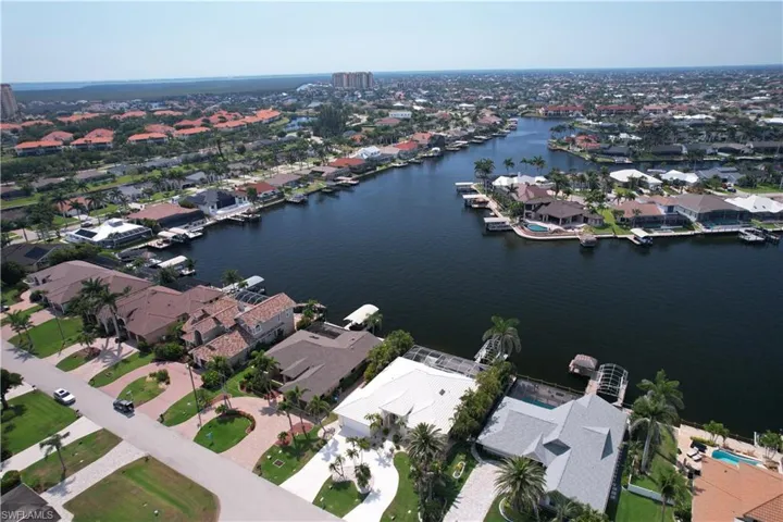 Drone / aerial view with a residential view and a water view