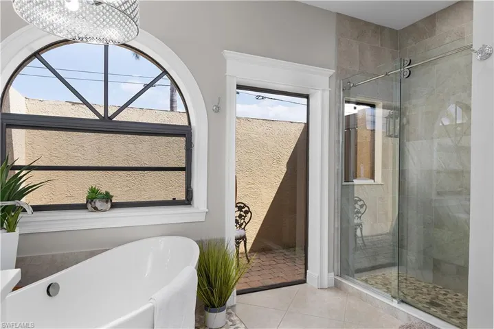 Tiled living area featuring ceiling fan, ornamental molding, visible vents, and recessed lighting