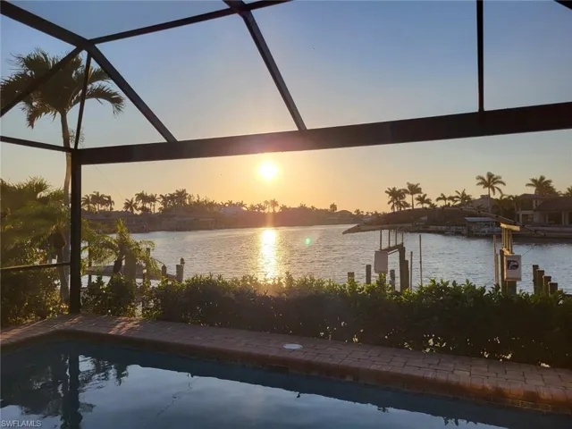 Property view of water featuring a boat dock
