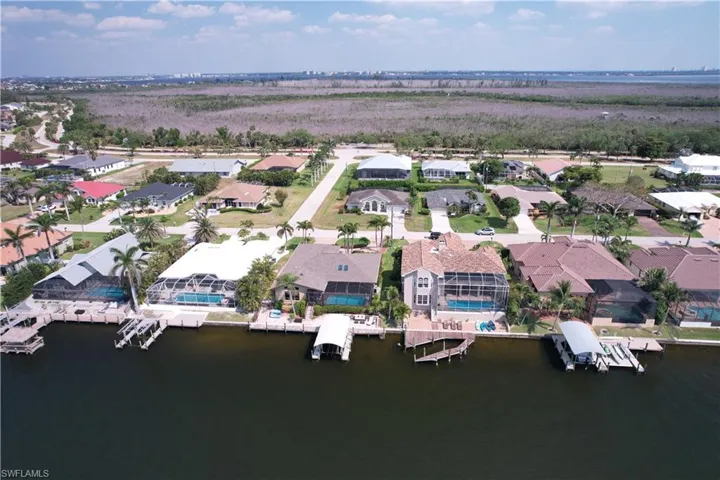 Drone / aerial view featuring a water view and a residential view
