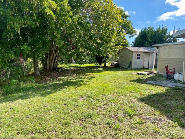 Some lush green grass on the side of the home