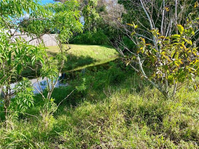 The home has a small creek on one side