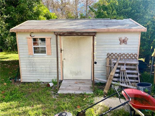 A large 14' x 11' shed. Empty and waiting