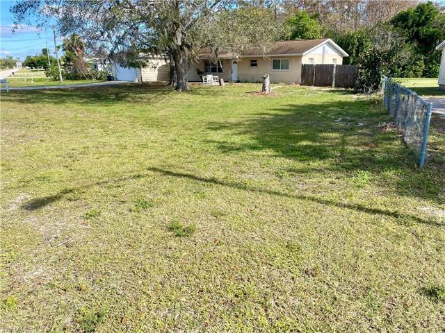 The lot has 180' frontage & 180' on the right, creating this massive open space in the front yard