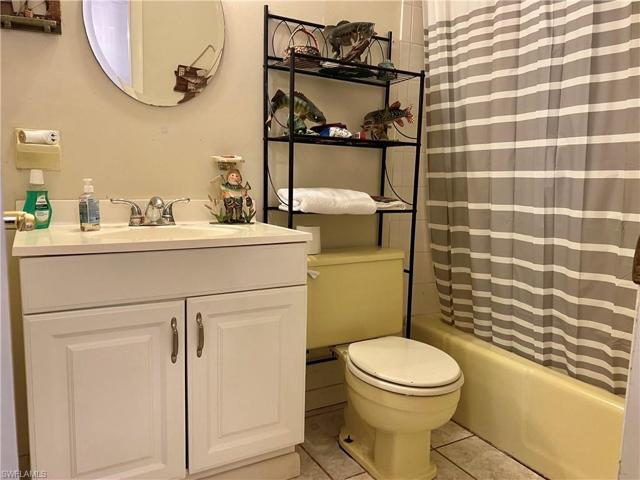 The guest bathroom with a tub/shower combo
