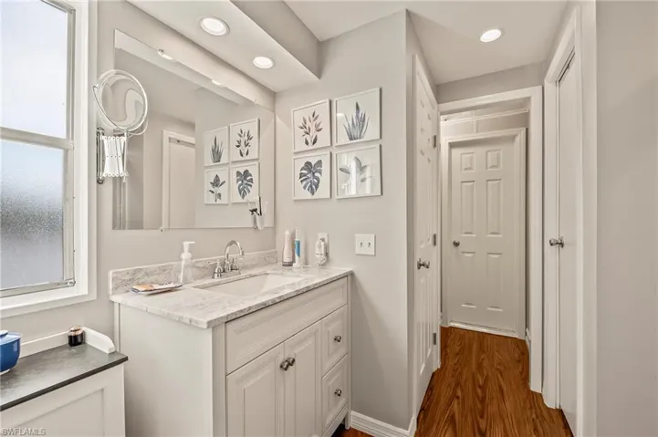 Bathroom featuring hardwood / wood-style floors and vanity