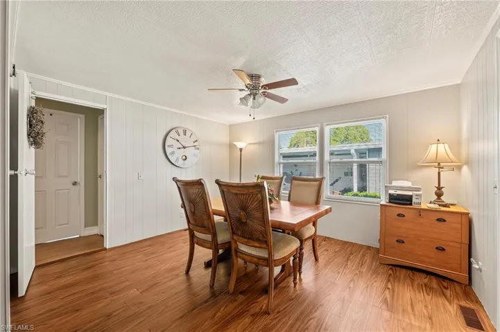 Dining area featuring ceiling fan and hardwood / wood-style floors