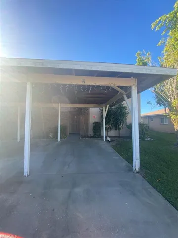 One assigned carport, additional paved parking on each side