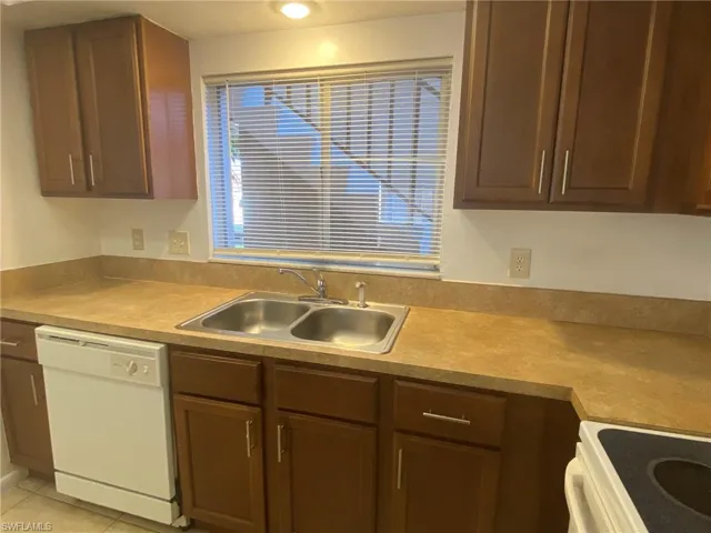 Kitchen offers lots of storage and workspace