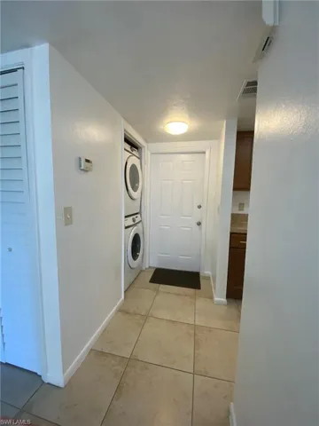 Front door with hallway to Kitchen and Living areas