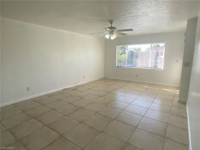 Large living room with view of canal and sliders to Lanai