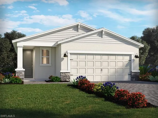 View of front facade featuring a garage and a front yard