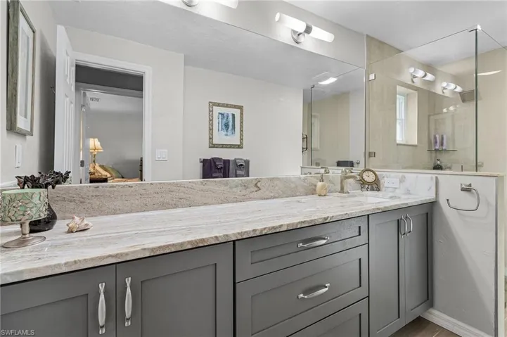 Guest Bathroom featuring a walk-in shower.