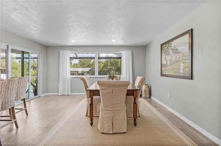 Dining area with canal/pool views.