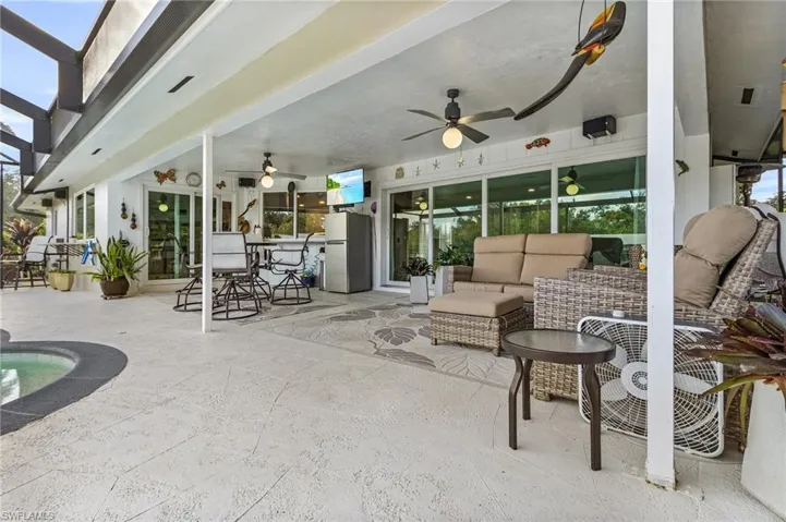 View of patio featuring an outdoor living space and ceiling fan