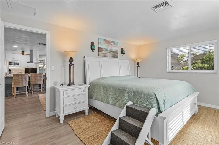 Primary bedroom off kitchen.