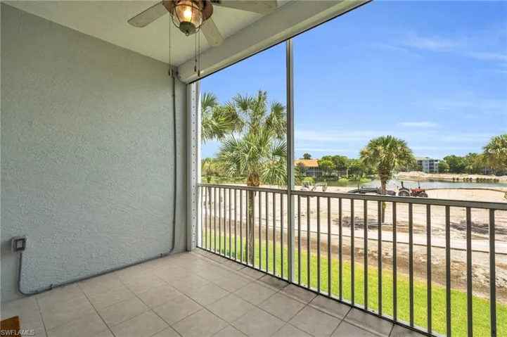 Unfurnished sunroom featuring plenty of natural light and ceiling fan