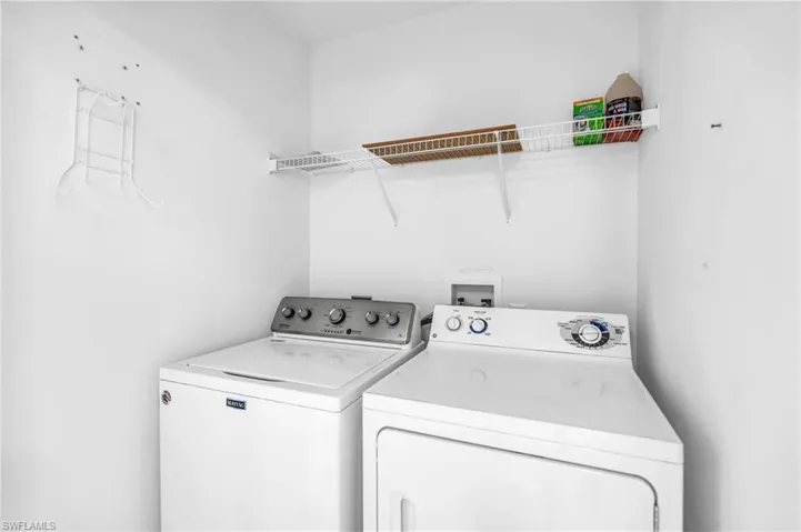 Clothes washing area with washing machine and dryer