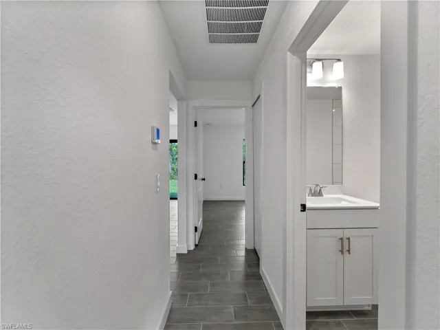 Hall featuring a textured wall