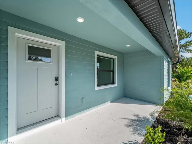 Entrance to property featuring a patio