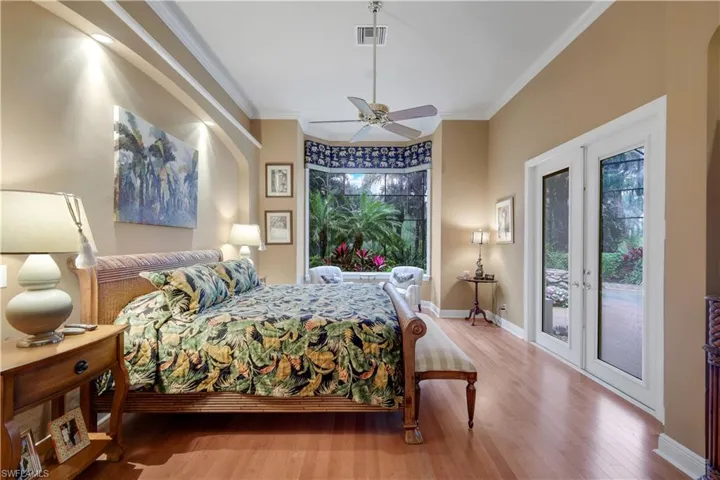 The primary suite is privately tucked away from the main living areas of the home.