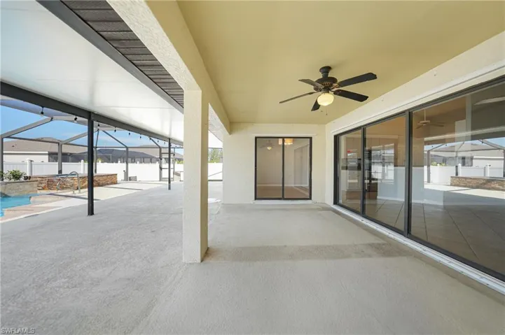 View of patio / terrace with glass enclosure and ceiling fan
