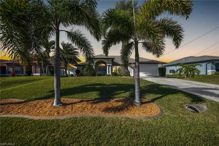 View of front of property with a lawn