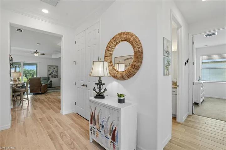 Corridor featuring wood tiled floors, recessed lighting, and ornamental molding