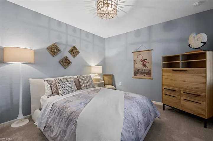 Bedroom with carpet flooring and baseboards