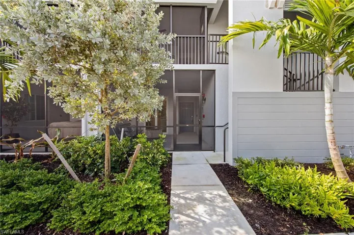 Doorway to property with stucco siding