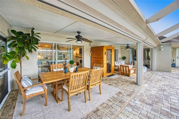 View of patio / terrace with outdoor dining area, ceiling fan, and outdoor lounge area
