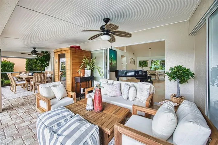 Sunroom featuring lofted ceiling