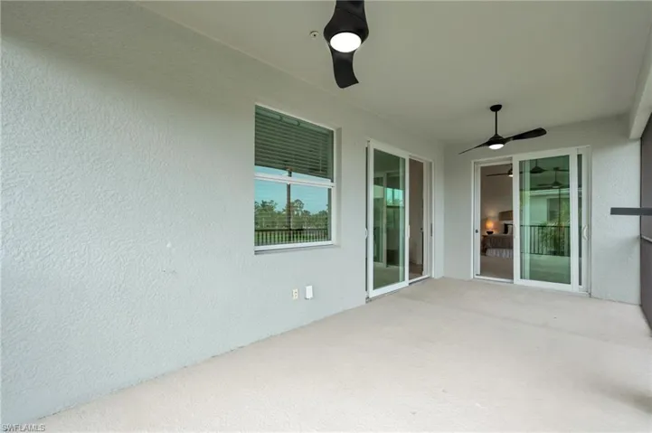 View of patio featuring ceiling fan
