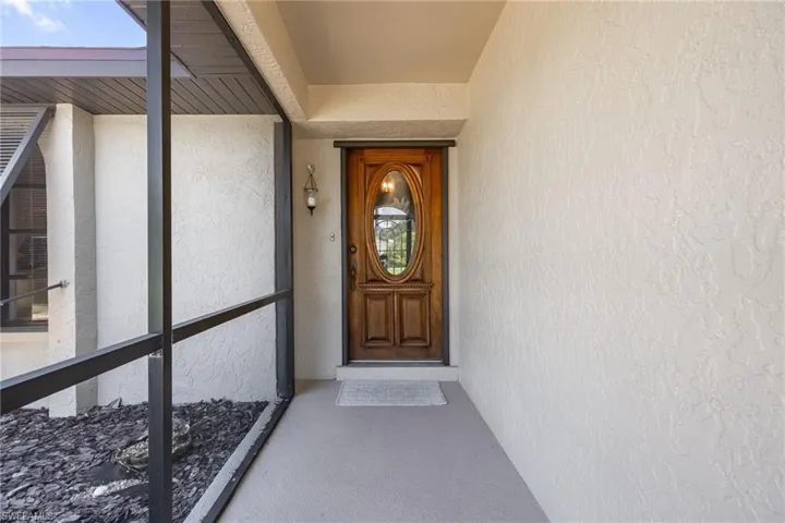 Screened entry porch with textured exterior walls