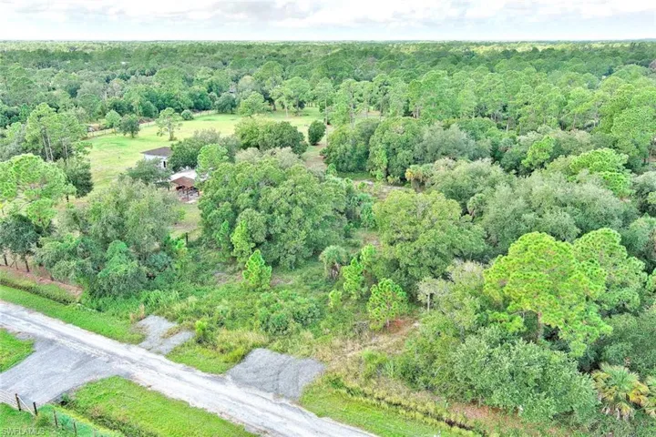 View of property location featuring a heavily wooded area
