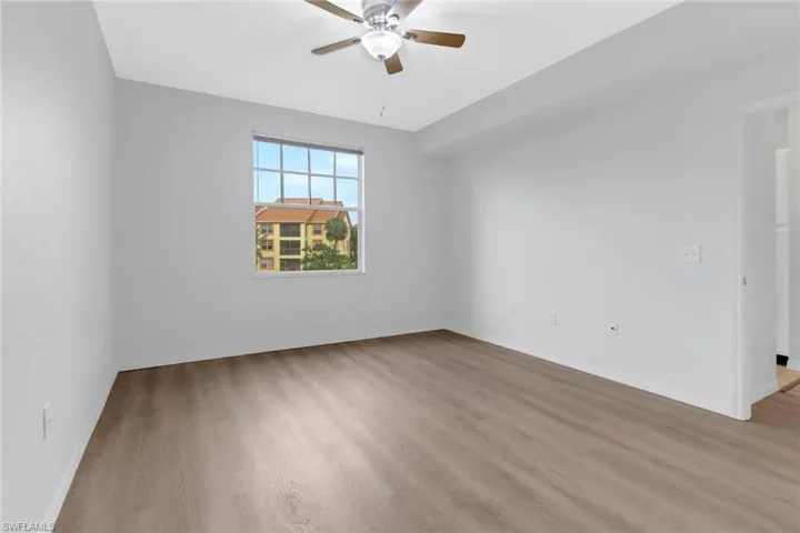 Spare room with light hardwood / wood-style floors and ceiling fan