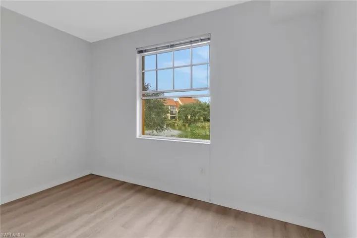 Unfurnished room with light hardwood / wood-style floors