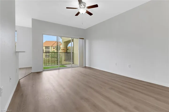 Unfurnished room featuring wood-type flooring and ceiling fan