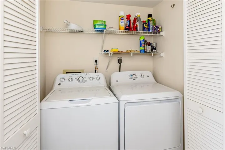 Clothes washing area with washer and clothes dryer