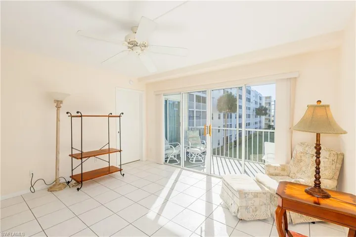 Sitting room featuring ceiling fan and light tile patterned floors