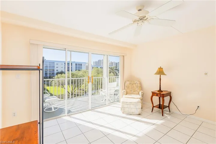 Unfurnished room with light tile patterned floors and ceiling fan