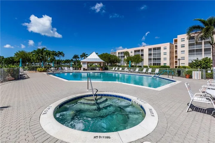 View of pool with a gazebo, a patio area, and a community hot tub