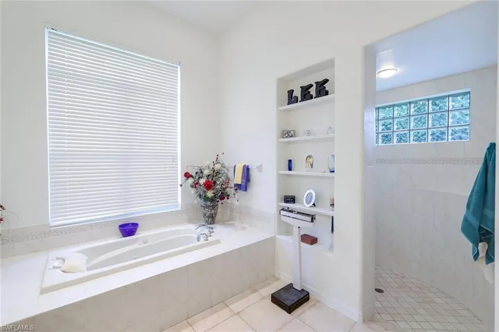 A glass of wine and a good book can both be enjoyed in this fabulous tub!
