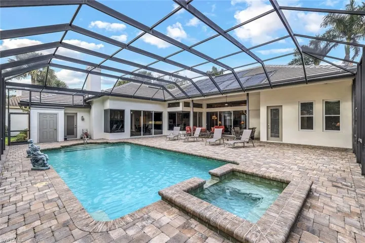 Magnificent screened pool area with plenty of covered space!