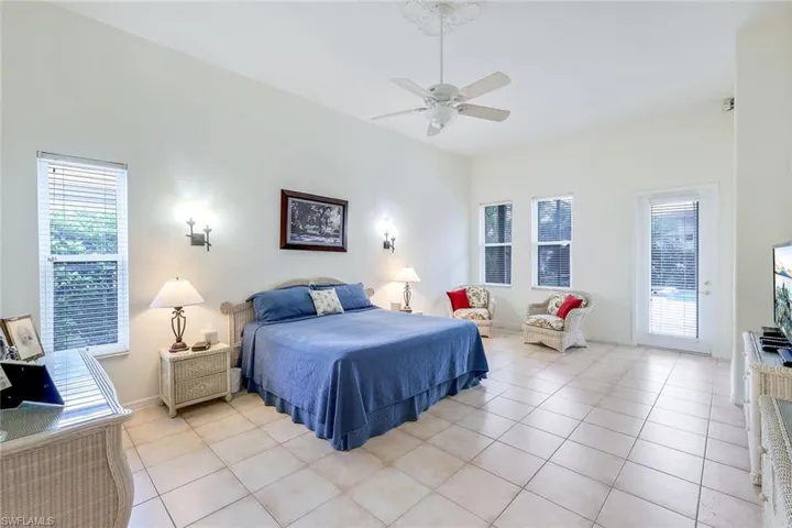 Large primary bedroom with access to the pool.